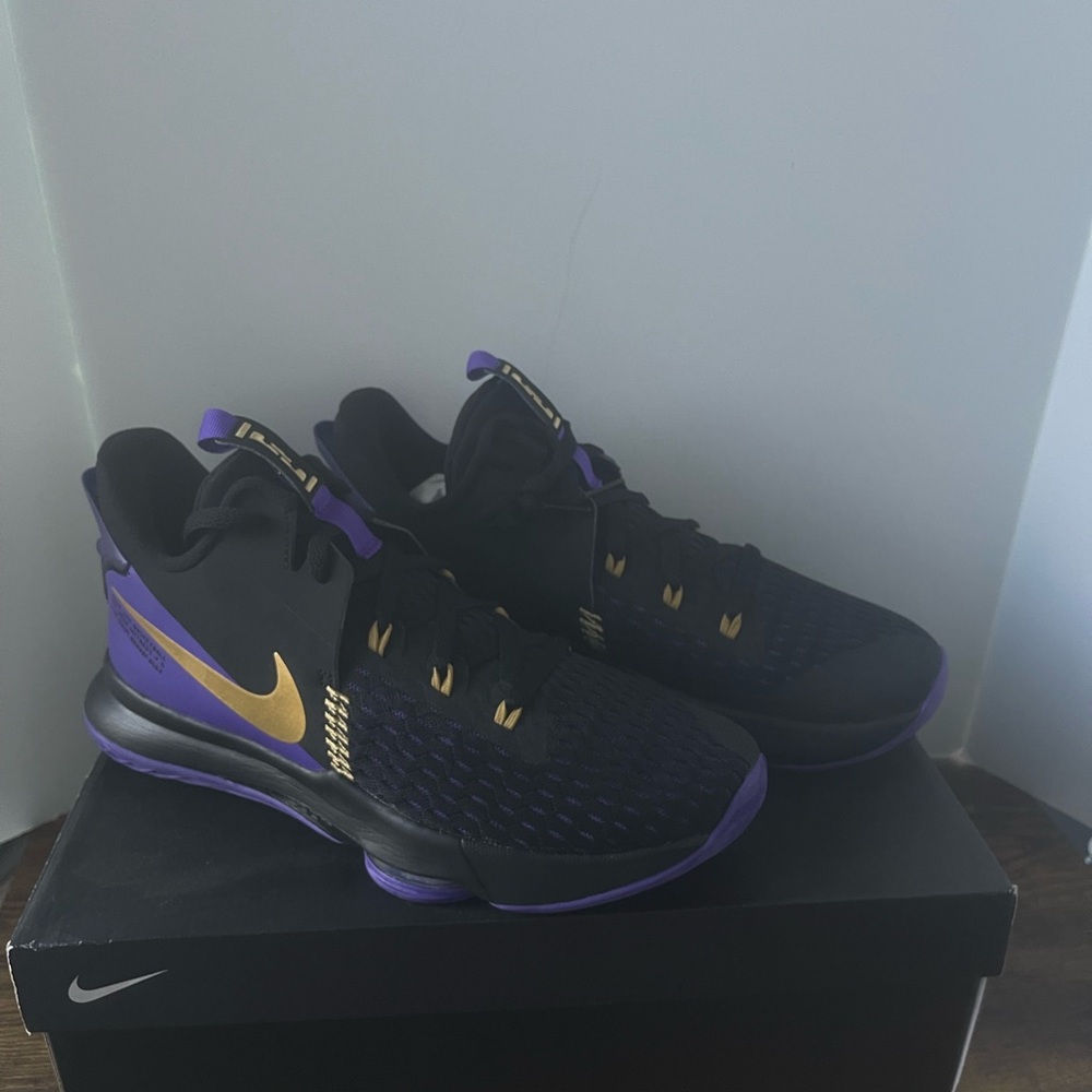 Nike Black and Purple Athletic Shoes with Gold Accents